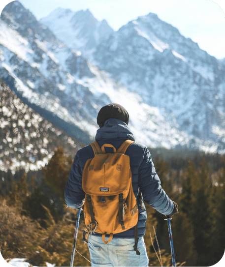 view of the snowy mountains and a skier